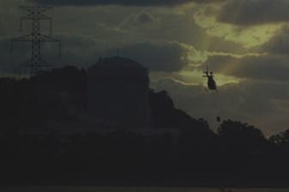Figure 4: A helicopter disposing of bodies at night.